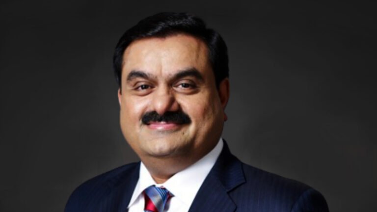 Gautam Adani smiling during a business event