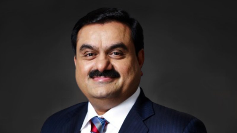 Gautam Adani smiling during a business event